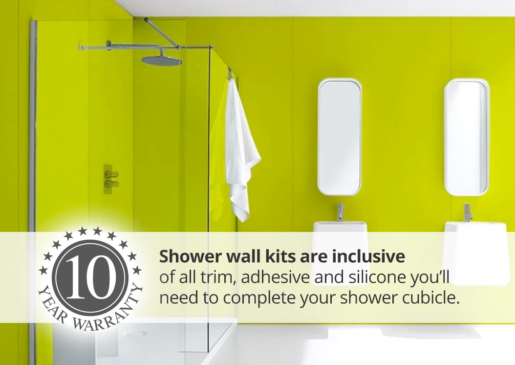 Green wet wall panels in modern bathroom with shower and two sinks.